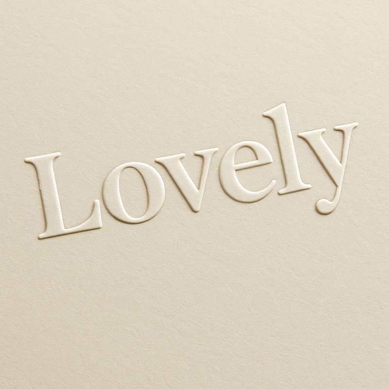 Embossed Lovely lettering on cream board