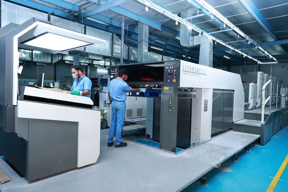 Offset press operators at work